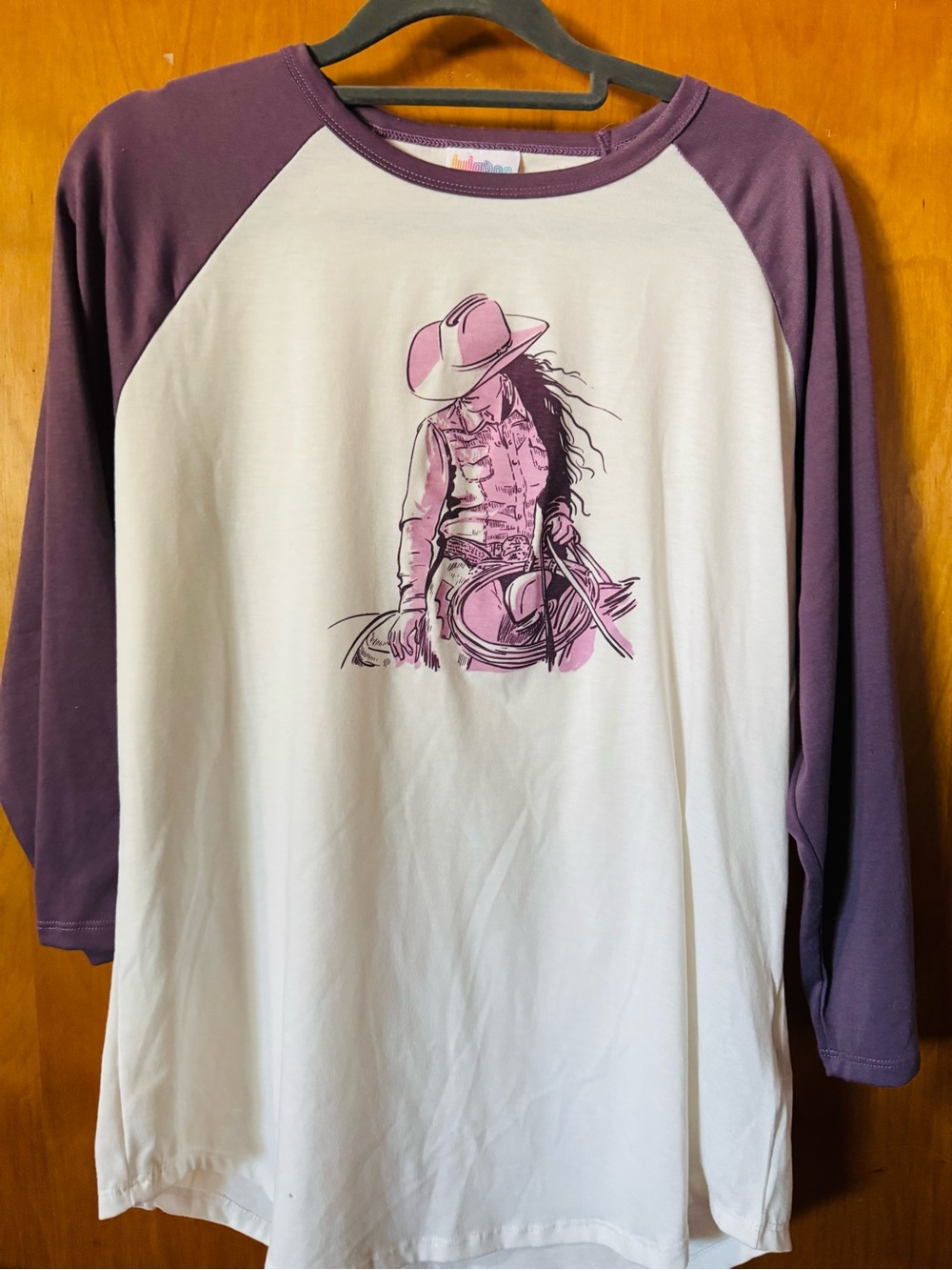LuLaRoe White Tee with Purple Raglan Sleeves and Pink Cowboy Graphic